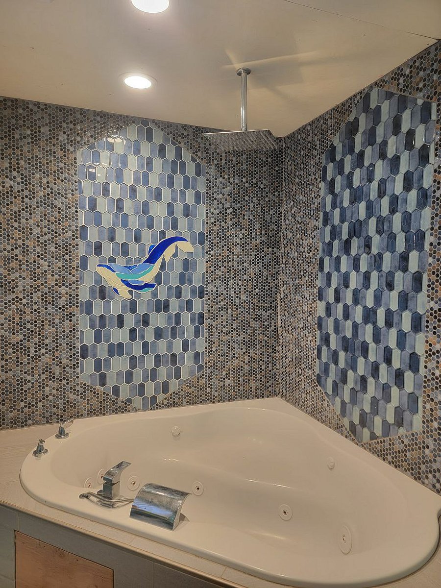Pamper yourself in the giant jetted tub with rain shower