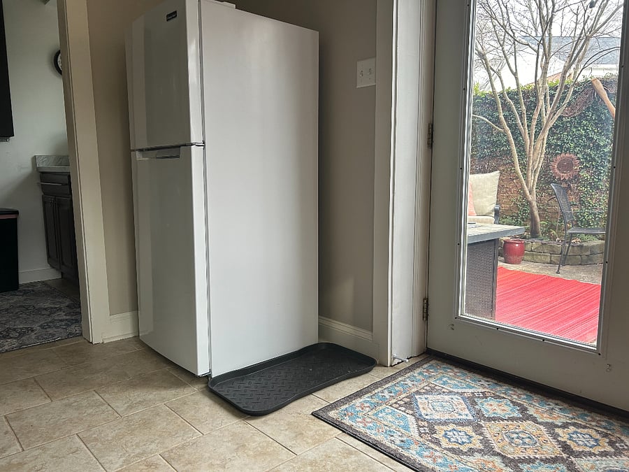 Full fridge next to kitchenette