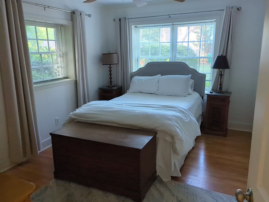 Queen bed with large closet, room darkening drapes, smart wall mounted tv, large dresser.  Includes linens. 