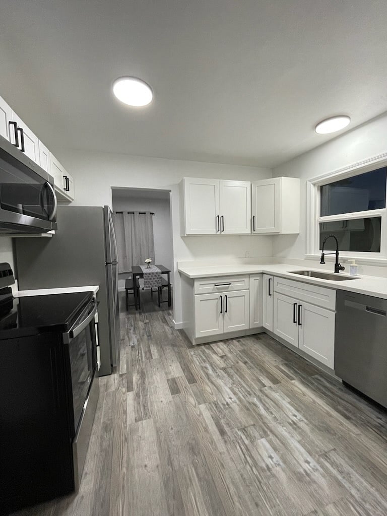 upstairs full kitchen. kitchenette downstairs