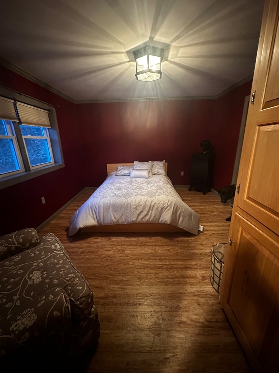 Master with walk in closet, black out blinds and dark walls for beat sleep