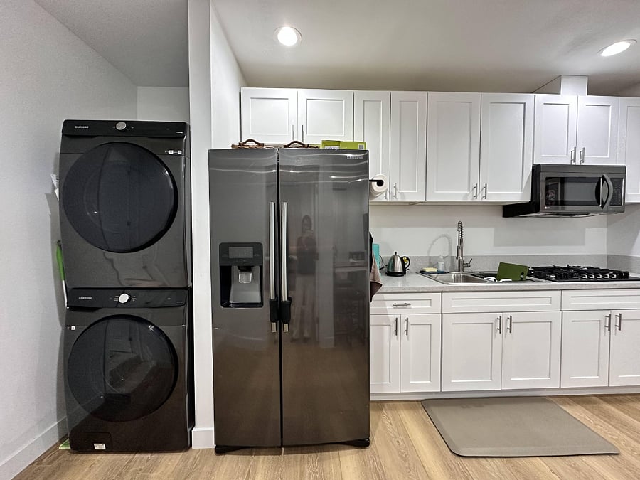 In unit washer/dryer, full-sized fridge, kitchenette with stove and microwave