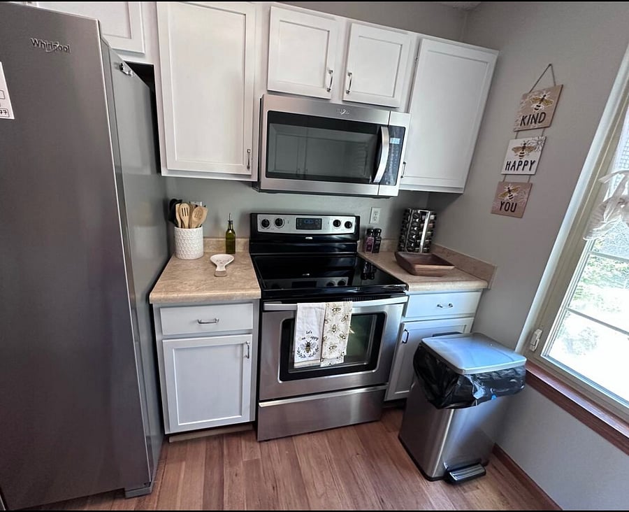 Kitchen fully furnished; refrigerator, stove, microwave, dishwasher, many small appliances with spices, olive oil, utensils, pots and pans, silverware, dishes, towels, soaps, cleaning supplies, sponges
