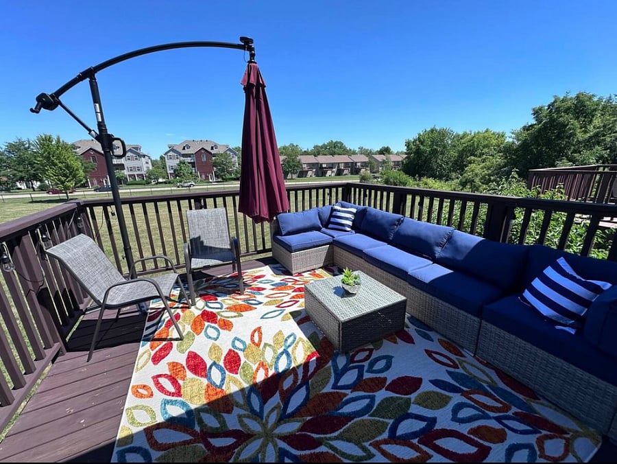 upstairs deck, outdoor furniture with large umbrella, grill
