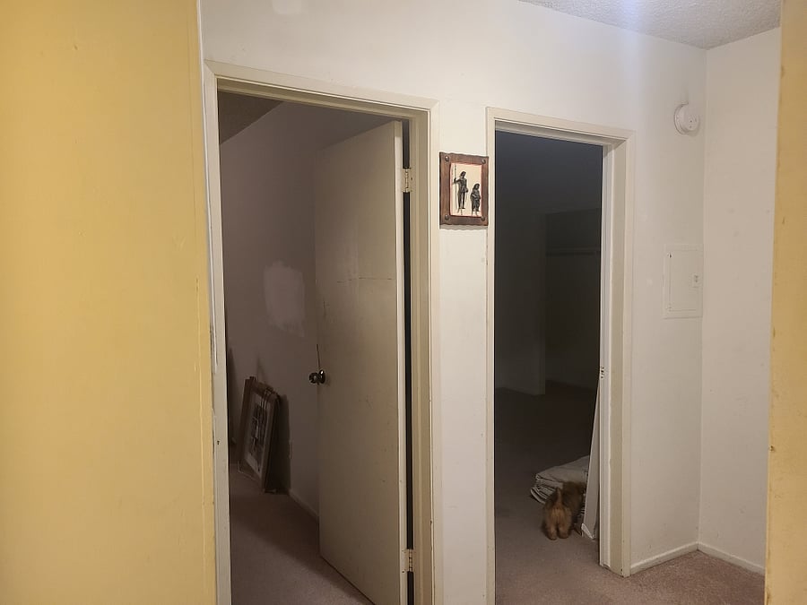 The hallway that connects with to the rooms and bathroom
