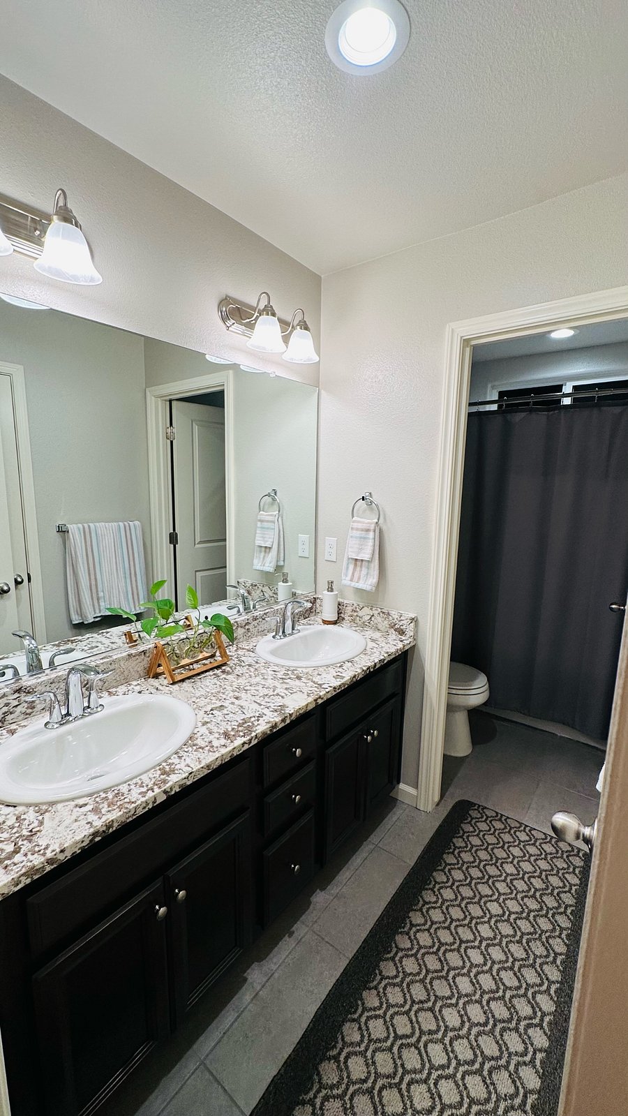 Your private bathroom, complete with fresh complimentary bath towels for your comfort.