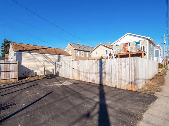 Free parking behind the home on this parking pad! Free street parking!