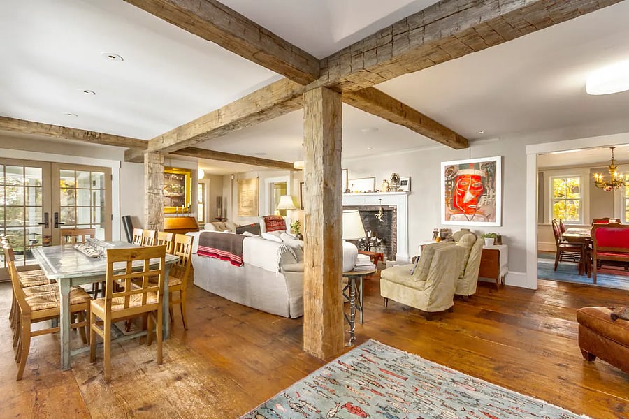 Warm living room with dining area for meals, or spread out and work with high speed internet. Beautiful artwork hangs throughout the house.