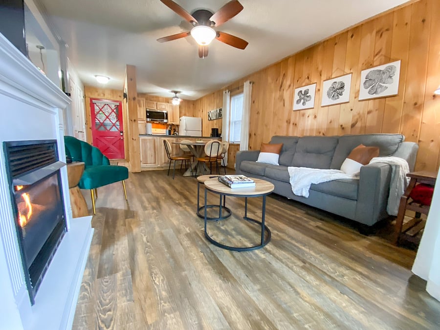 The living room is the perfect place to wind down after a long day. Featuring a cozy gas fireplace, it's the perfect spot to curl up with a good book or watch TV. 