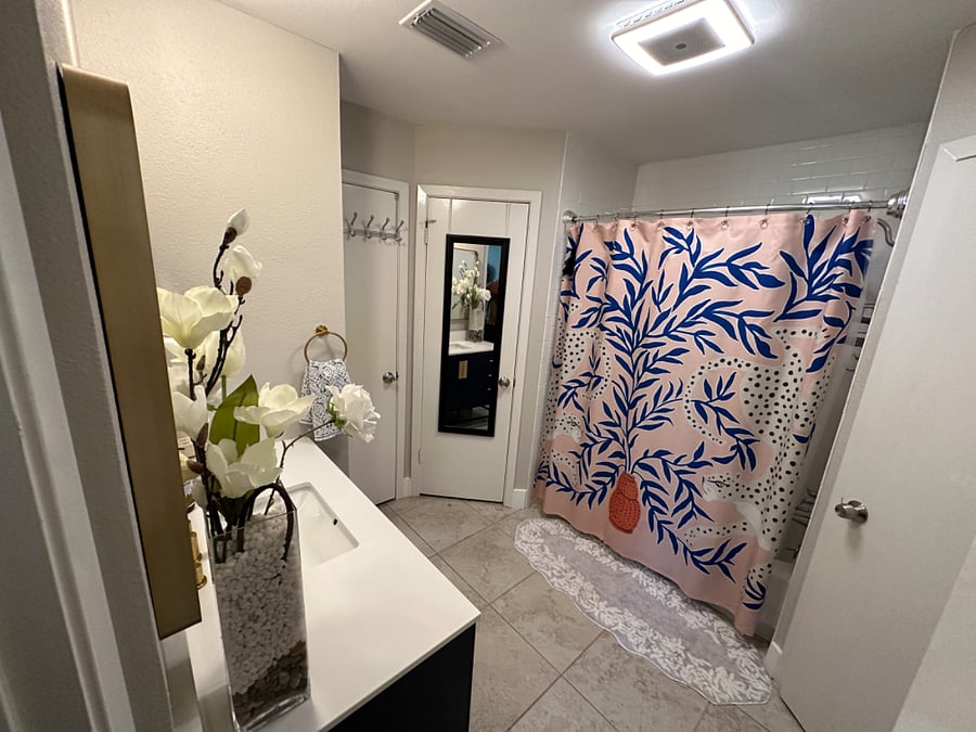 En suite master bathroom. There are two closets and a linen closet. Updates made in 2023.