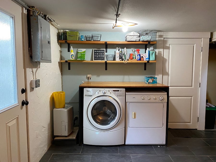 Outside basement door to shared laundry room. Basement apartment door.