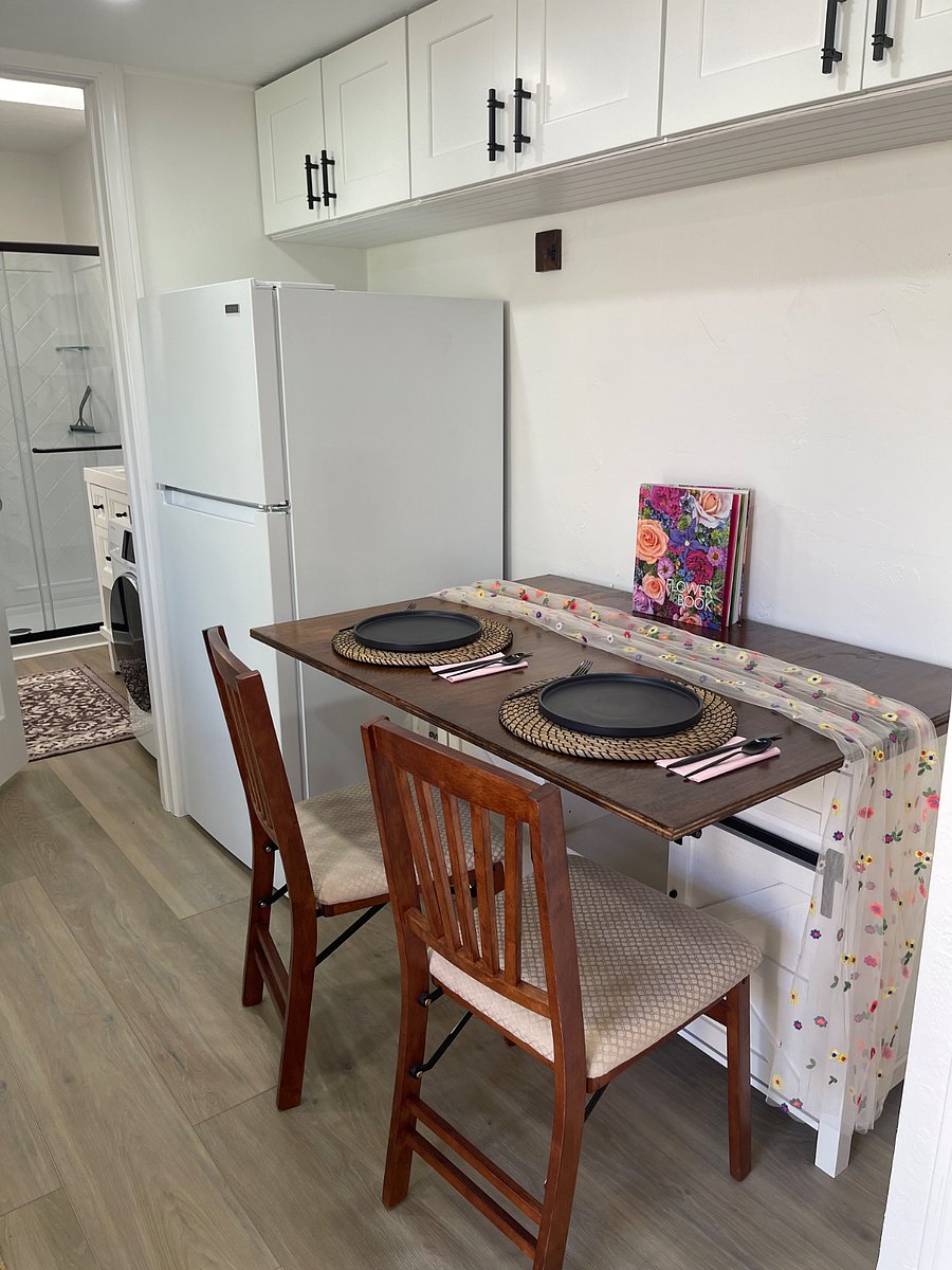 Pull down dining table can be used as office desk with supply storage in cabinet