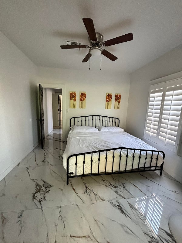 Second bedroom with king bed, he and she closet