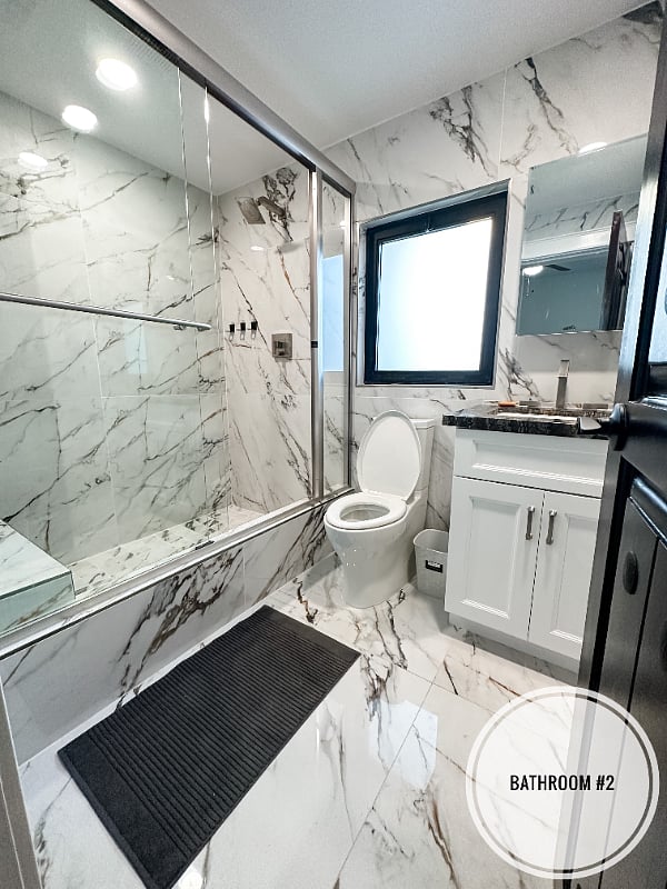 Second full bath attached to the bedroom with queen bed