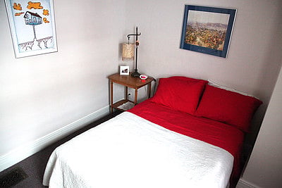 Second bedroom in street view suite. Full size bed.
