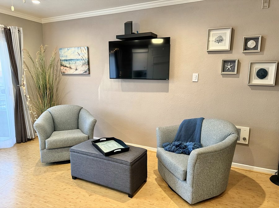 Kick your feet up while relaxing in a comfy swivel rocker