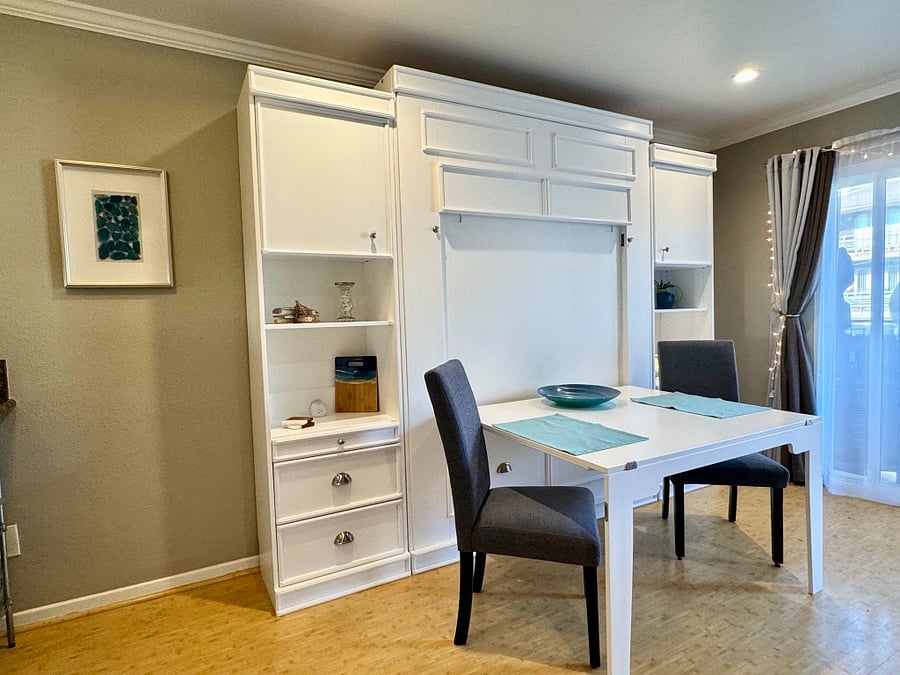 With bed locked in place, the pull down table offers dining for 2 or 4