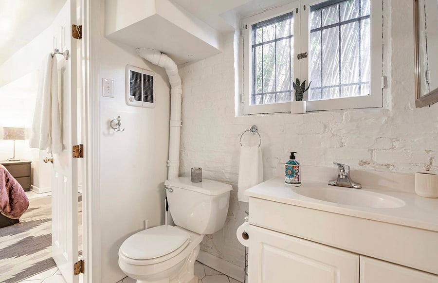 Bathroom, accessible via the kitchen and bedroom.