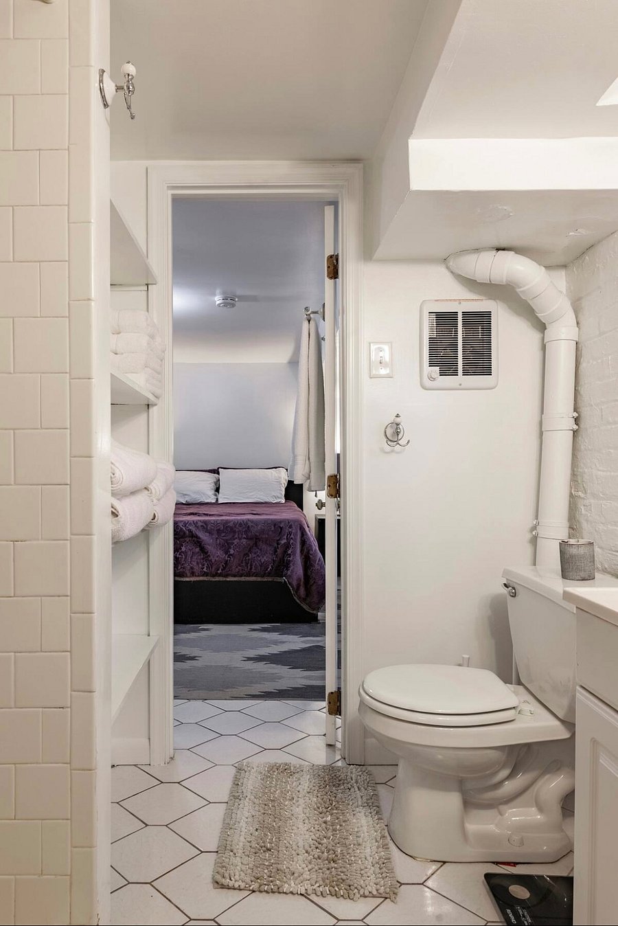 Bathroom, accessible via the kitchen and bedroom.