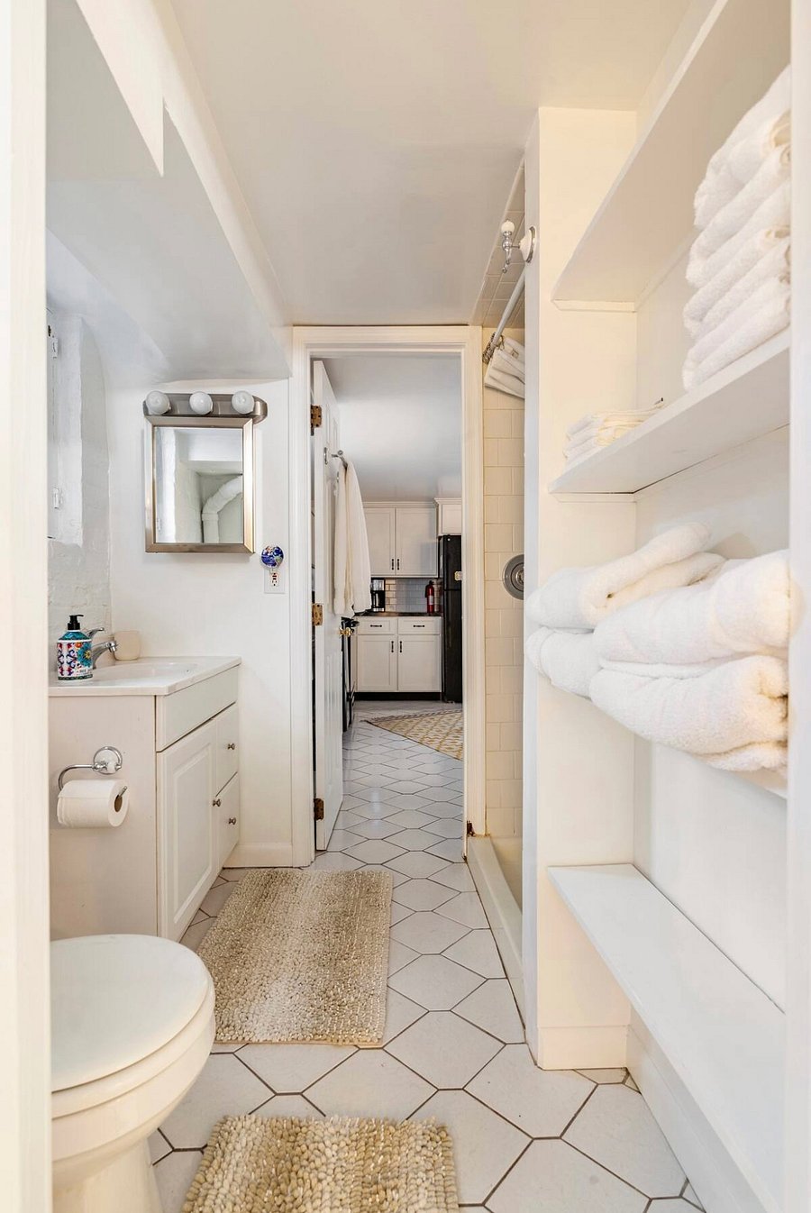 Bathroom, accessible via the kitchen and bedroom.