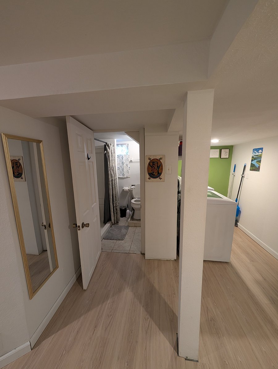 Bathroom and laundry area off of kitchen area