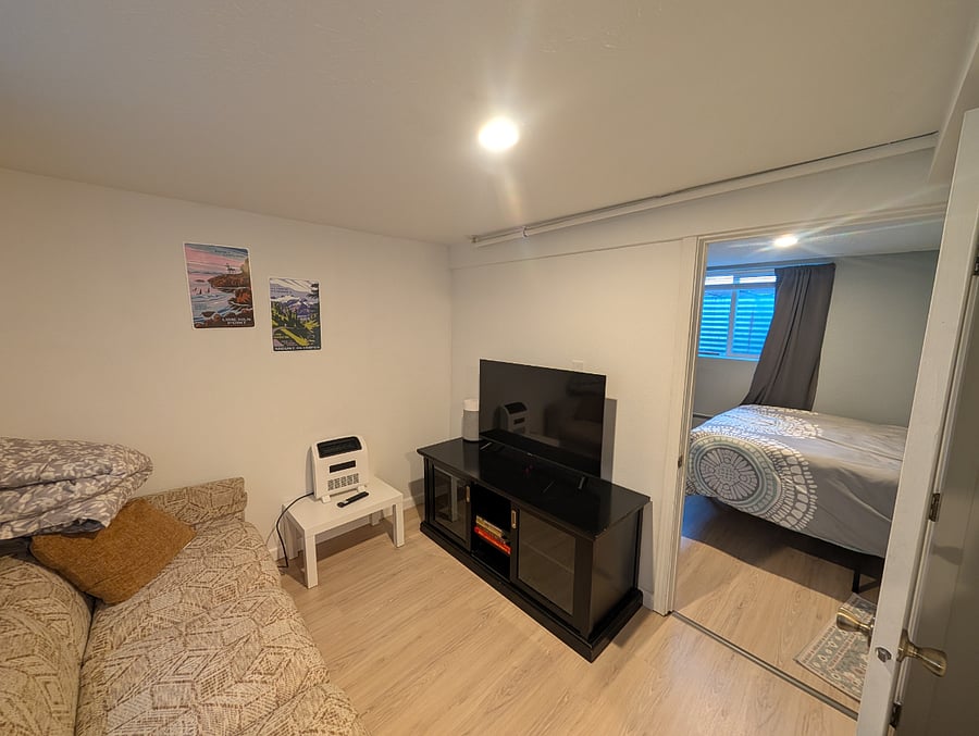 Living room with smart TV (connected to internet- streaming services not included)