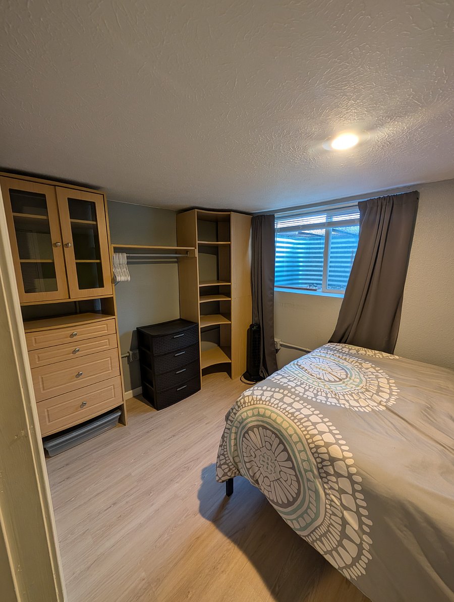 Bedroom with large egress window and built in closets