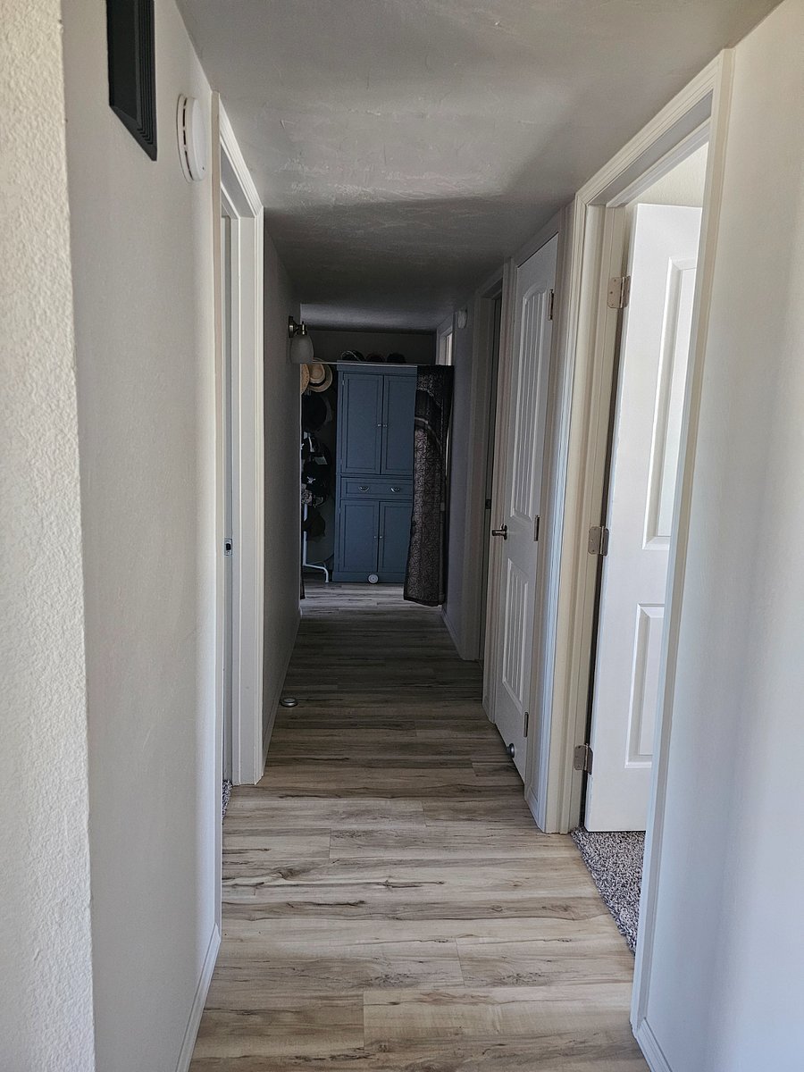 Main hallway to all four rooms