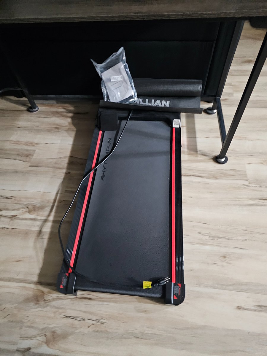 portable movable treadmill in front family tv room