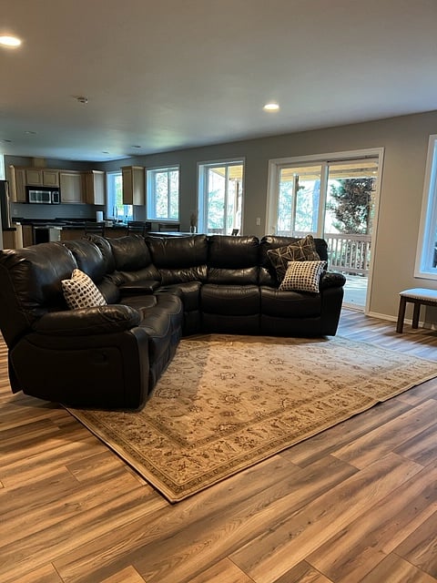 Woodland Traveler Lodging - 1 of 2 Sitting/TV/fireplace common areas