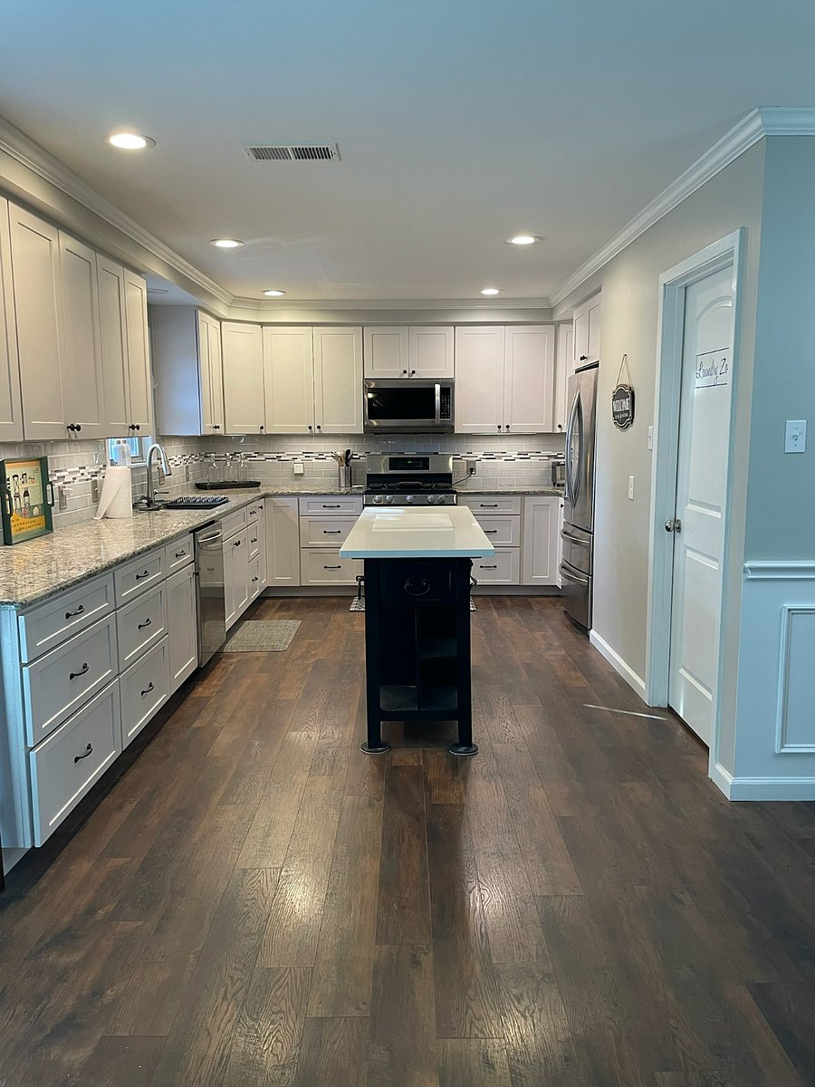 Chef's island, plenty of storage, well stocked kitchen and stainless appliances.