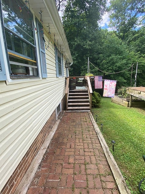 Private entrance with solar lighting and private seating area.