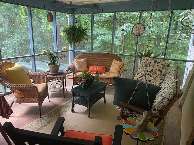 Shared screen porch with ceiling fan.