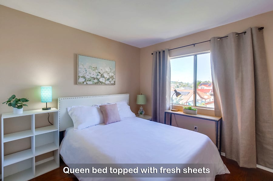 Wake up to a bright and refreshing morning on your cozy queen bed in Bedroom 2