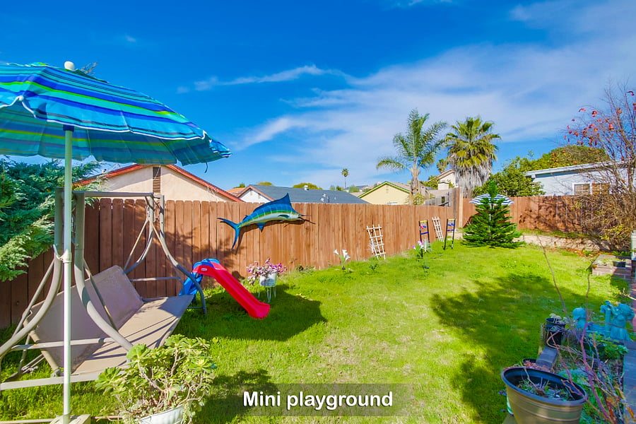 A mini playground in a spacious corner of our backyard is a big hit w/ the little ones