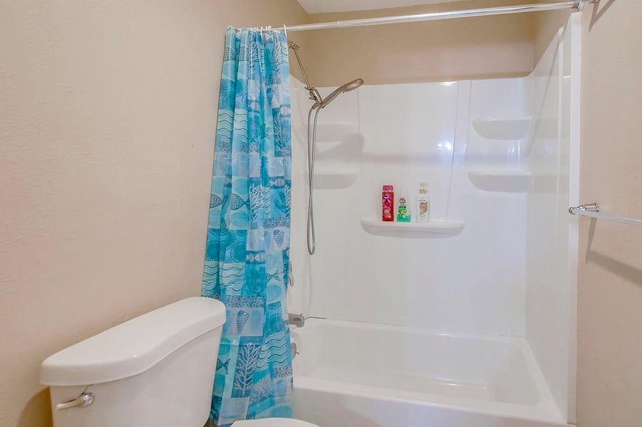 Freshen up in our tub & shower combo, complete w/ bathroom essentials