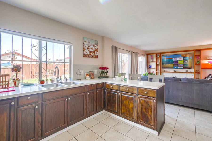 Sit or grab a drink on the spacious kitchen island as you keep the chef company