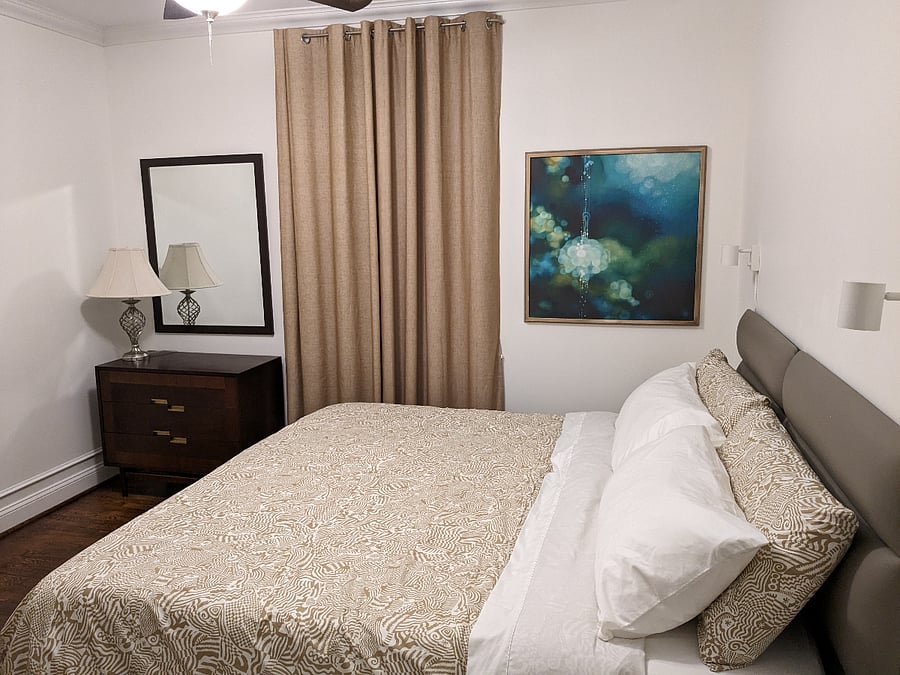 Comfortable king size bed, blackout curtains on both windows.