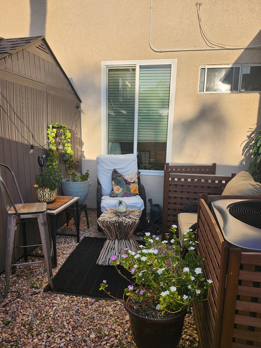 Side private sitting area with outdoor grill.