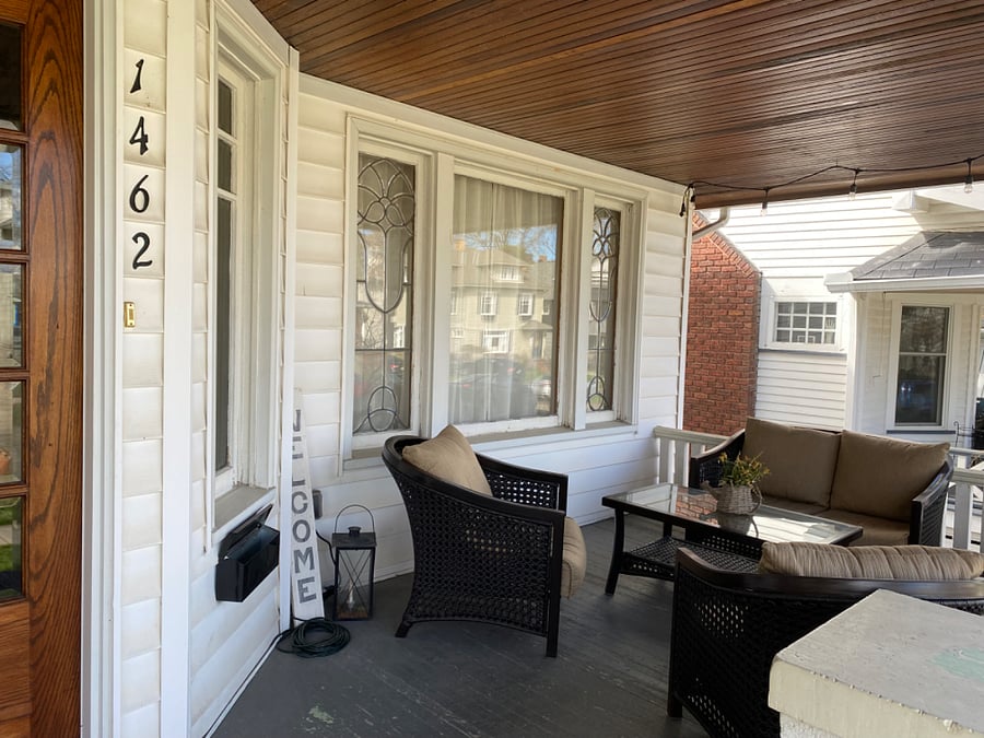 Front porch with cushioned furniture