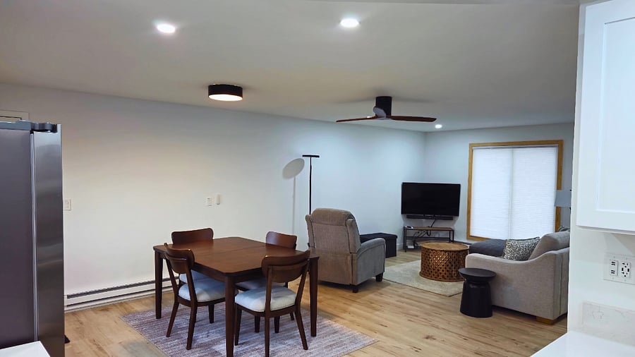 View from the kitchen. The open floor plan of the kitchen and living space creates a welcoming atmosphere, perfect for enjoying conversations, listening to music, watching sports on TV, or sharing your favorite movies together.