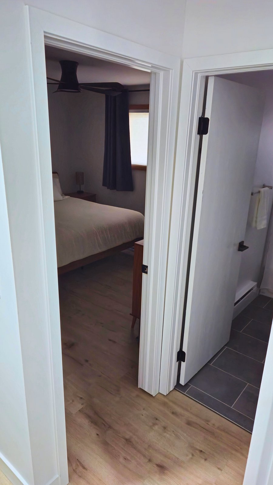 Photo showing location of bathroom door to main bedroom with King Bed.