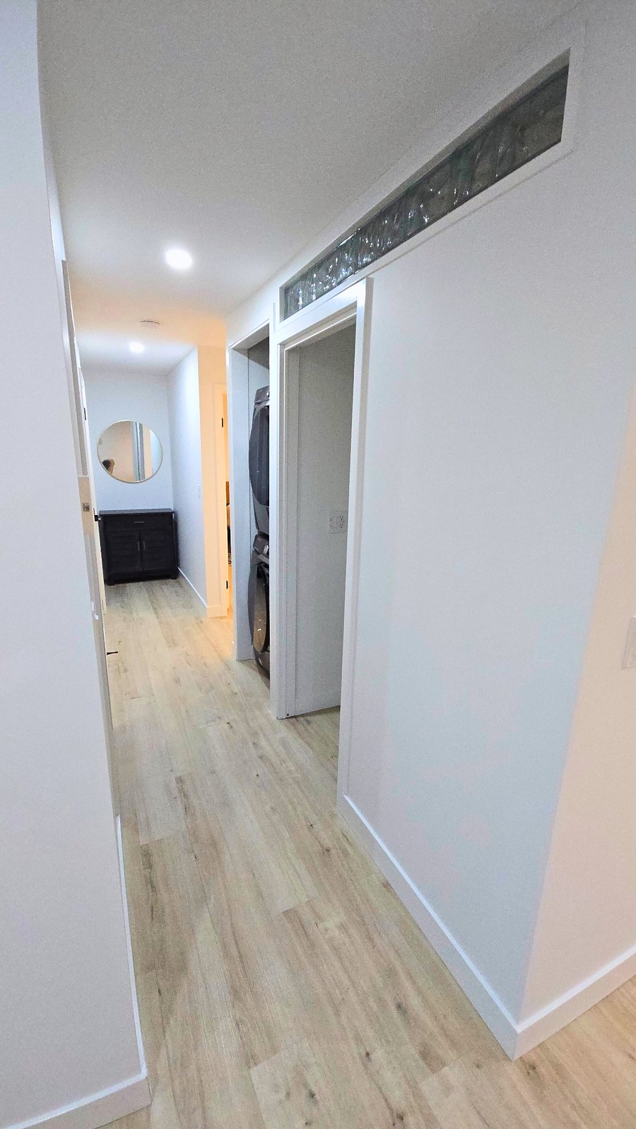 Main hallway leads to all bedrooms and bathrooms.
