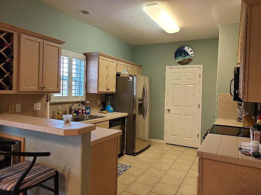 fully equipped kitchen; laundry through the door; modern large washer/dryer.