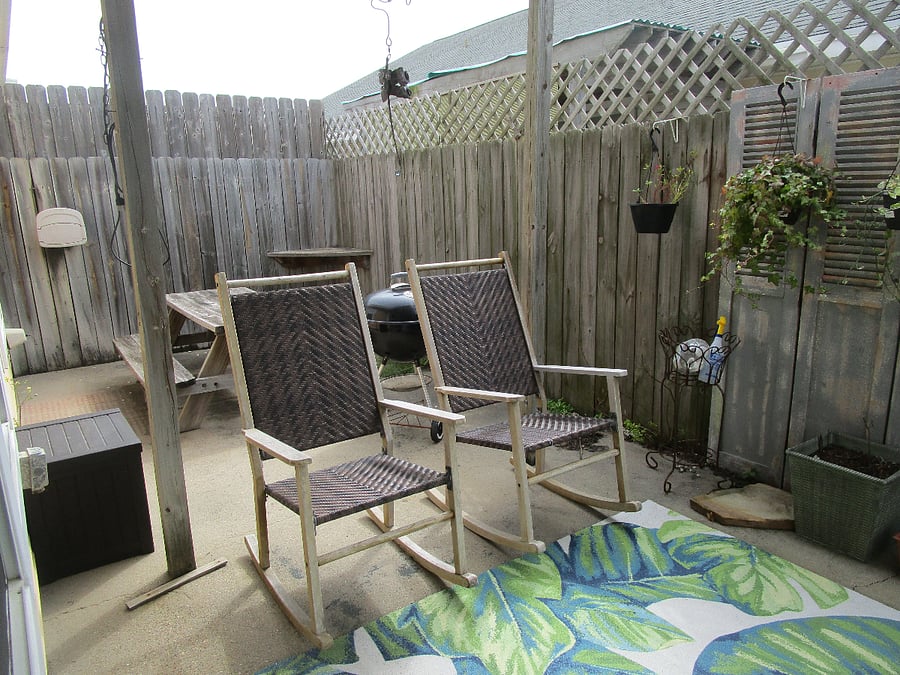 outside patio, plants, sitting area and picnic table area