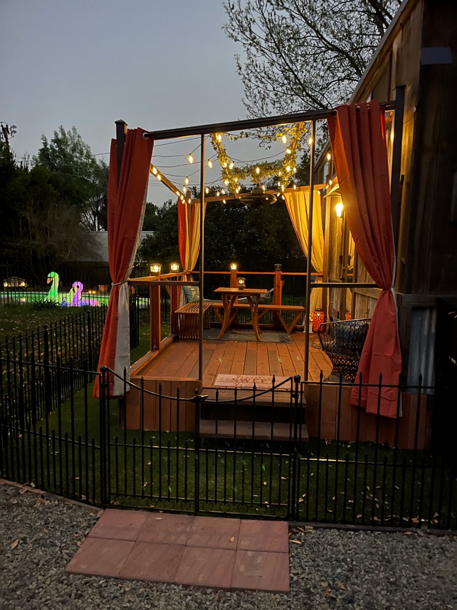 Tiny House deck at night. Solar lighting makes a magical aura.