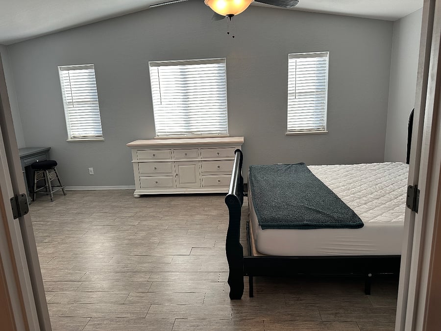 Large bedroom with comfortable Tuft & Needle King bed.