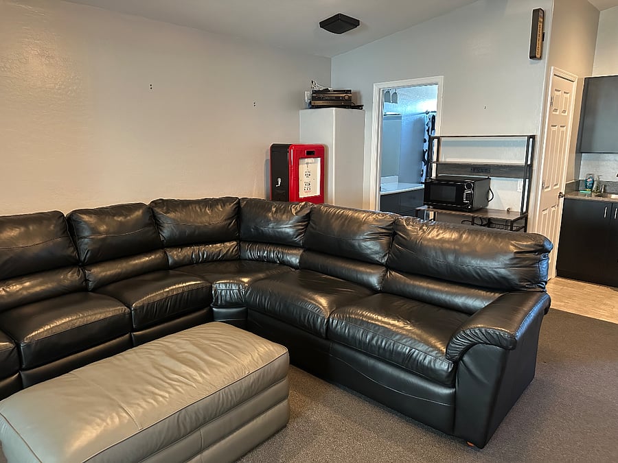 Large leather couch, with 2 reclining seats.