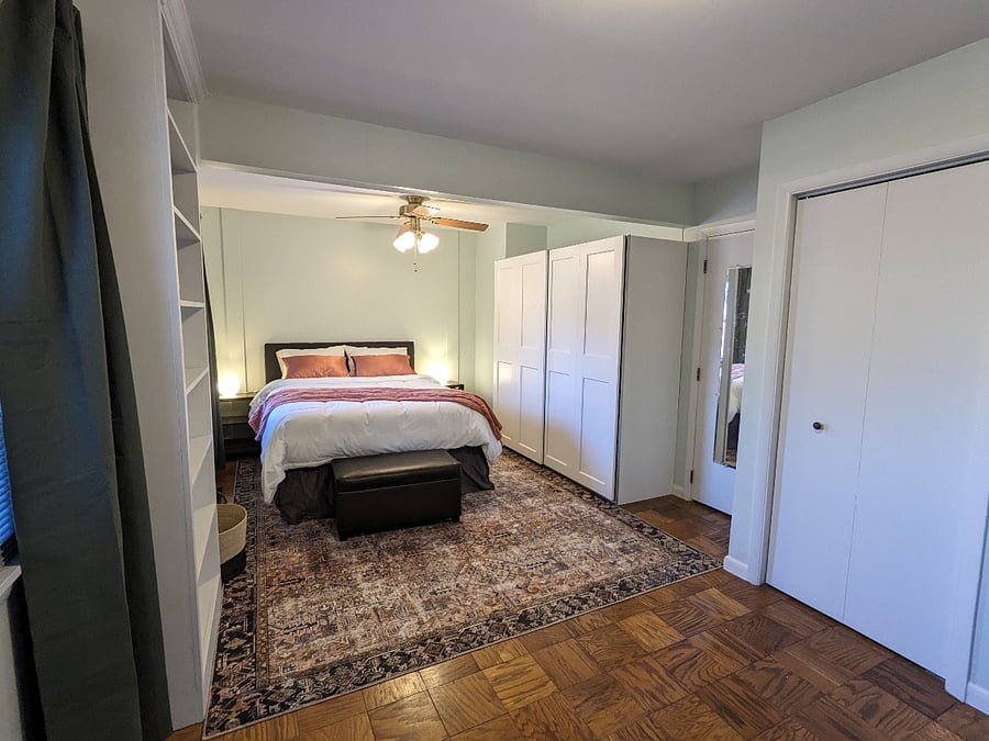 Main bedroom has a Queen sized bed and lots of storage