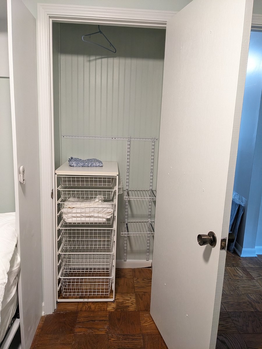 Second bedroom closet. Hanging space, shelves, wire drawers